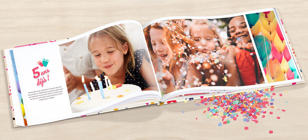 Un livre photo ouvert avec des motifs de fête d'anniversaire, des confettis et des bougies.