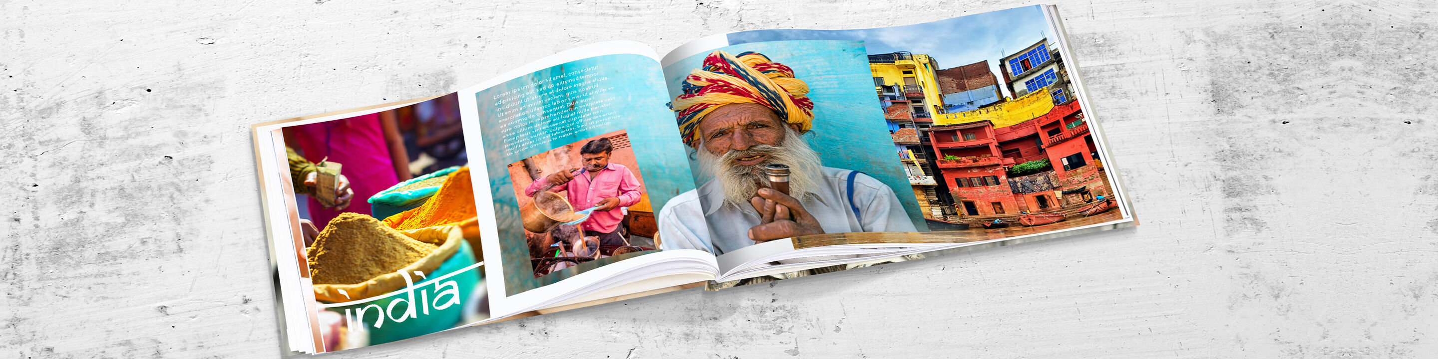 Livre CEWE FOTOBUCH ouvert avec des images colorées de l'Inde et des designs créatifs.