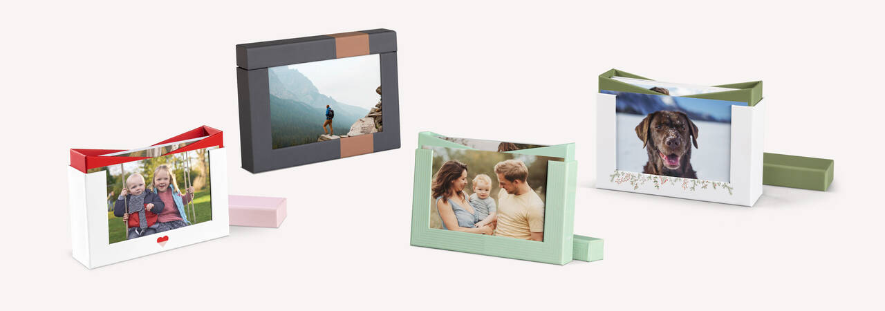 Boîtes photo variées et conçues avec amour montrant des moments heureux.
